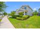 Well-manicured front yard with green grass and trimmed shrubs, enhancing the curb appeal of the lovely home at 4633 Ballantrae Blvd, Land O Lakes, FL 34638