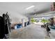 Well-lit garage with an open door, showcasing the home's exterior at 4633 Ballantrae Blvd, Land O Lakes, FL 34638