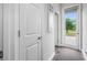 Bright hallway with an exterior door and neutral decor showcasing the home's design at 4633 Ballantrae Blvd, Land O Lakes, FL 34638