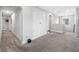 Hallway with neutral paint, carpet and trim, including an alcove with storage at 4633 Ballantrae Blvd, Land O Lakes, FL 34638