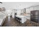Modern kitchen features an island with bar seating, stainless steel appliances, and ample cabinet space at 4633 Ballantrae Blvd, Land O Lakes, FL 34638