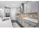 Well-lit kitchen featuring modern appliances, a large sink, and ample cabinet space at 4633 Ballantrae Blvd, Land O Lakes, FL 34638