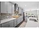 Spacious kitchen with white countertops, gray cabinetry, and a stylish backsplash at 4633 Ballantrae Blvd, Land O Lakes, FL 34638