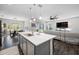Open-concept kitchen with island, dining area, and a seamless flow to the living room at 4633 Ballantrae Blvd, Land O Lakes, FL 34638