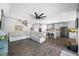 Comfortable living room flows into a modern kitchen with a large sectional sofa at 4633 Ballantrae Blvd, Land O Lakes, FL 34638