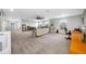 Spacious living room with gray carpet, sofas, windows, and a ceiling fan at 4633 Ballantrae Blvd, Land O Lakes, FL 34638