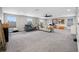 Spacious living room with two sofas, windows, and gray carpet flooring at 4633 Ballantrae Blvd, Land O Lakes, FL 34638