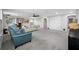 Spacious living room with gray carpet, sofas, and large windows at 4633 Ballantrae Blvd, Land O Lakes, FL 34638