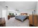 Spacious main bedroom with ceiling fan, sitting area, and lots of natural light at 4633 Ballantrae Blvd, Land O Lakes, FL 34638