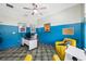 Spacious office area with a bright two-tone paint scheme and tiled floors at 4633 Ballantrae Blvd, Land O Lakes, FL 34638