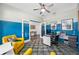 Well-lit office with stylish blue walls, a full desk and extra seating at 4633 Ballantrae Blvd, Land O Lakes, FL 34638