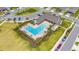 Aerial shot of the community pool and clubhouse area with professional landscaping at 4633 Ballantrae Blvd, Land O Lakes, FL 34638