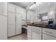 Bathroom featuring custom cabinetry, granite counter tops, and a glass enclosed shower at 4706 Fox Hunt Dr, Tampa, FL 33624