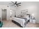 Vaulted bedroom with a ceiling fan and ensuite bathroom and walk-in closet at 4706 Fox Hunt Dr, Tampa, FL 33624