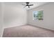 Bedroom with neutral carpet and ceiling fan and a large window providing natural light at 4706 Fox Hunt Dr, Tampa, FL 33624