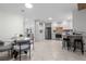 Bright, open kitchen with stainless steel appliances, breakfast bar, and adjacent dining area at 4706 Fox Hunt Dr, Tampa, FL 33624
