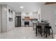 Well-lit kitchen with stainless steel appliances, ample cabinet space, and breakfast bar seating at 4706 Fox Hunt Dr, Tampa, FL 33624