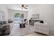 Bright living room with backyard pool views, comfortable seating, and decorative accents at 4706 Fox Hunt Dr, Tampa, FL 33624