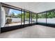 Screened patio featuring tile flooring, views of backyard, pool and lots of natural light at 4706 Fox Hunt Dr, Tampa, FL 33624