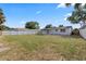 Spacious backyard with partial fencing, offering privacy and room for outdoor activities at 4803 Sierra Madre Dr, Tampa, FL 33634
