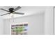A well-lit bedroom features a ceiling fan and window for natural light at 4803 Sierra Madre Dr, Tampa, FL 33634
