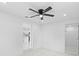 Bright bedroom featuring white walls, ceiling fan, and a closet at 4803 Sierra Madre Dr, Tampa, FL 33634
