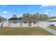 Charming single-story home with a well-maintained front yard and freshly painted exterior at 4803 Sierra Madre Dr, Tampa, FL 33634