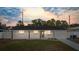 Well-lit single-story home with manicured front lawn showcasing the inviting entrance at 4803 Sierra Madre Dr, Tampa, FL 33634
