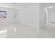 Bright living area with marble flooring, a front window, and seamless access to adjacent rooms at 4803 Sierra Madre Dr, Tampa, FL 33634