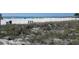 Sunny beach featuring white sand, blue water, and volleyball nets at 503, 509, Cottage, Land 69Th Ave, St Pete Beach, FL 33706