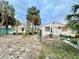 Houses on the lot featuring well maintained lawns and mature palm trees at 503, 509, Cottage, Land 69Th Ave, St Pete Beach, FL 33706