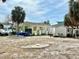 Outdoor view of a single story home with green exterior, storage shed, and ample space at 503, 509, Cottage, Land 69Th Ave, St Pete Beach, FL 33706