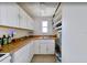 Bright kitchen with white cabinets and ample countertop space, ideal for cooking at 503, 509, Cottage, Land 69Th Ave, St Pete Beach, FL 33706