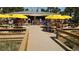 Beachfront eatery with bright yellow umbrellas and picnic tables, offering a casual dining experience at 503, 509, Cottage, Land 69Th Ave, St Pete Beach, FL 33706