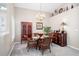 Inviting dining room with a glass table, seating for four, and buffet at 5117 Fairway One Dr, Valrico, FL 33596