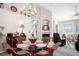 Charming dining room with glass table, wicker chairs, and elegant decor at 5117 Fairway One Dr, Valrico, FL 33596