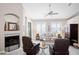 Comfortable living room with a fireplace, vaulted ceilings, and lots of natural light at 5117 Fairway One Dr, Valrico, FL 33596
