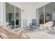 Covered outdoor patio with wicker furniture, perfect for relaxing and entertaining at 5117 Fairway One Dr, Valrico, FL 33596