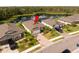 Aerial shot of a single-Gathering home with a pond view, backyard, and driveway at 5511 Badini Way, Palmetto, FL 34221