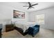 Calm bedroom featuring a ceiling fan, natural light, and carpet floors at 5511 Badini Way, Palmetto, FL 34221