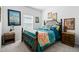 Bedroom with decorative bed frame and accents. Framed artwork adds a touch of elegance at 5511 Badini Way, Palmetto, FL 34221