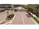 A gated community entrance ensures privacy and security for residents with well-manicured landscaping at 5511 Badini Way, Palmetto, FL 34221
