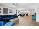 Open-concept living room offers a comfortable space with tile floors and easy access to the modern kitchen at 5511 Badini Way, Palmetto, FL 34221