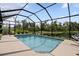 Enjoy this screened pool with its peaceful lake views from the comfort of your backyard at 5511 Badini Way, Palmetto, FL 34221