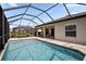 Relax by the screened pool and covered patio, ideal for outdoor living and entertaining at 5511 Badini Way, Palmetto, FL 34221