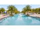 A large, inviting pool features ample seating and shaded areas for residents to enjoy the Florida sunshine at 5511 Badini Way, Palmetto, FL 34221
