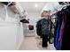 Organized walk-in closet with metal shelving, hanging rods, and storage space at 5511 Badini Way, Palmetto, FL 34221