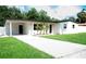 Charming single-story home featuring a well-manicured lawn and freshly painted exterior at 5625 Gateway Dr, Tampa, FL 33615