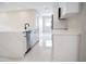 Modern kitchen featuring stainless appliances, a sleek island, and abundant cabinet space at 5625 Gateway Dr, Tampa, FL 33615