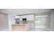 Modern kitchen featuring stainless appliances, a sleek island, and abundant cabinet space at 5625 Gateway Dr, Tampa, FL 33615